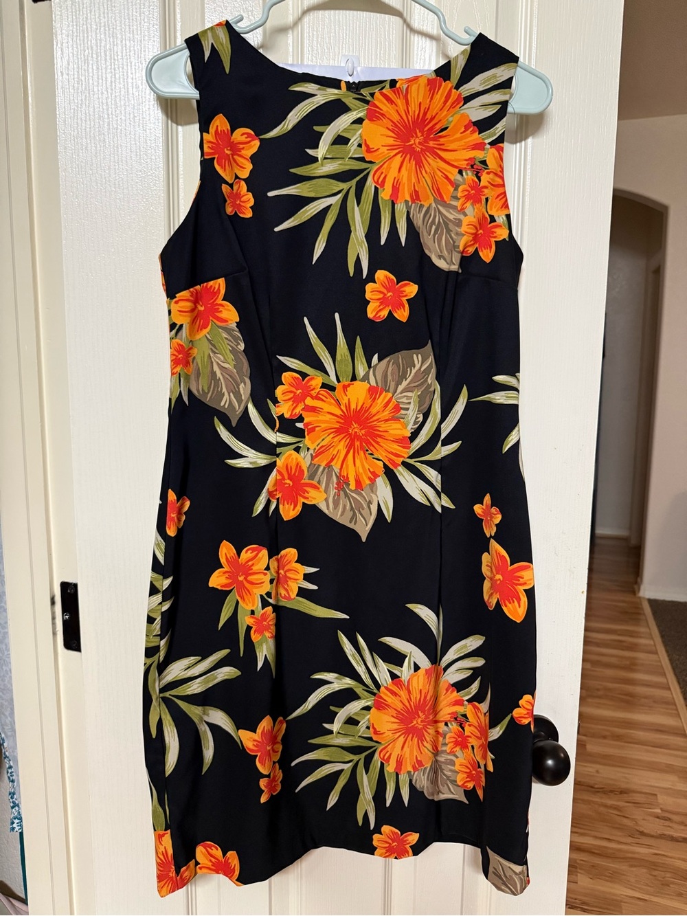 Sleeveless Black Mini Dress with Vibrant Orange Floral Print